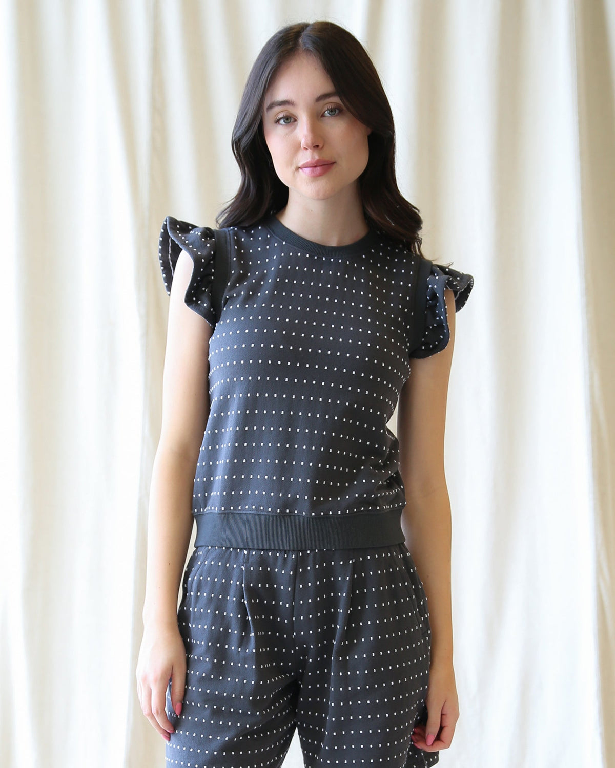 Downeast On Repeat Pullover, a cozy knit top in neutral color, displayed on a hanger against a plain background.