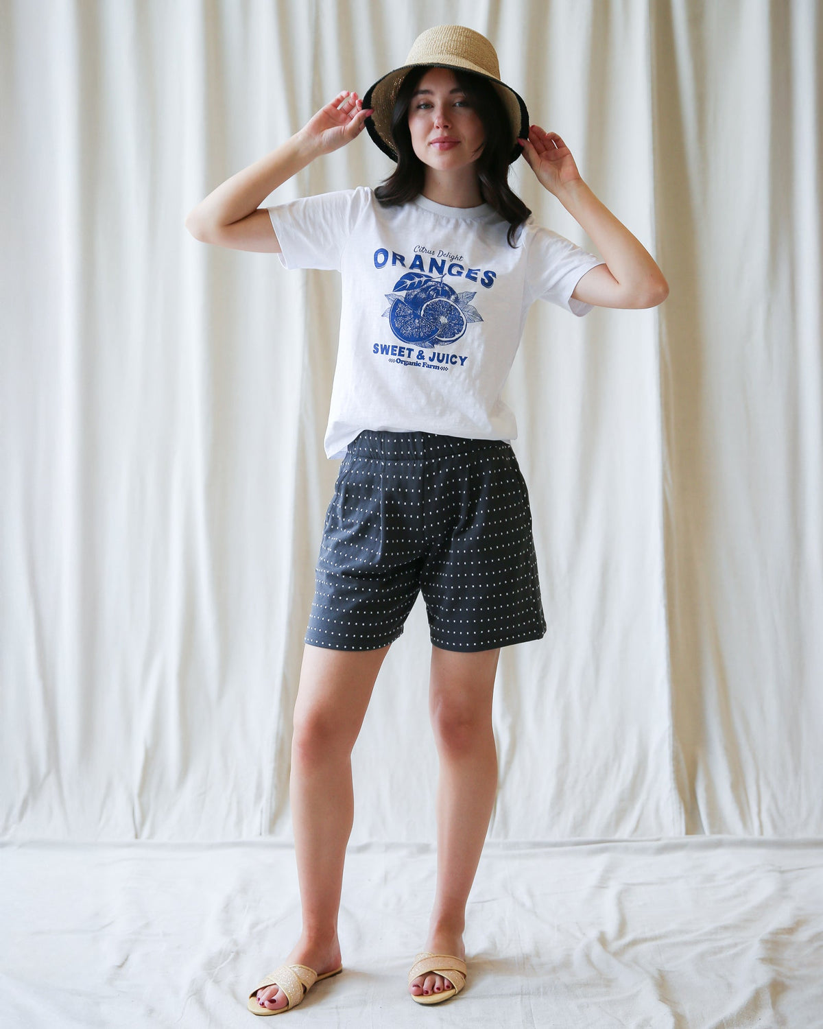 Light blue Downeast On Repeat Short made of lightweight fabric, displayed hanging with a relaxed fit and casual style.