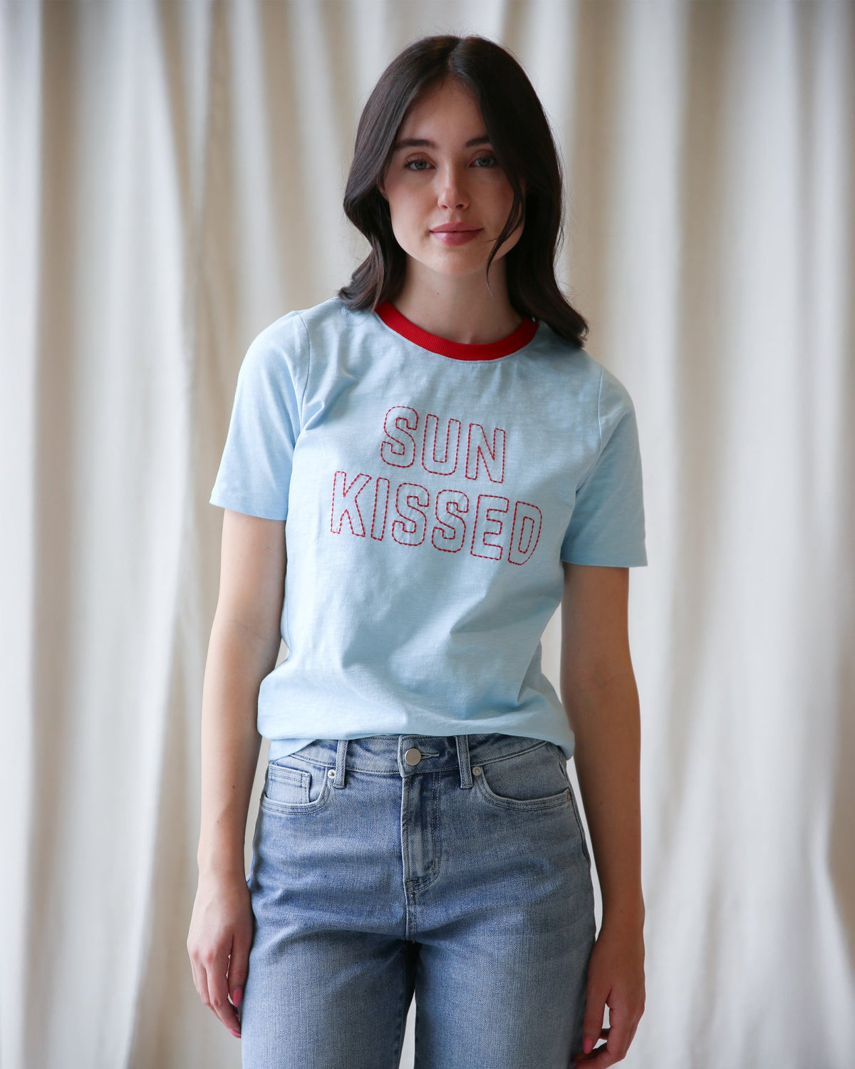 Sun Kissed Tee by Downeast, a casual tops featuring a relaxed fit and soft fabric, shown in a natural outdoor setting
