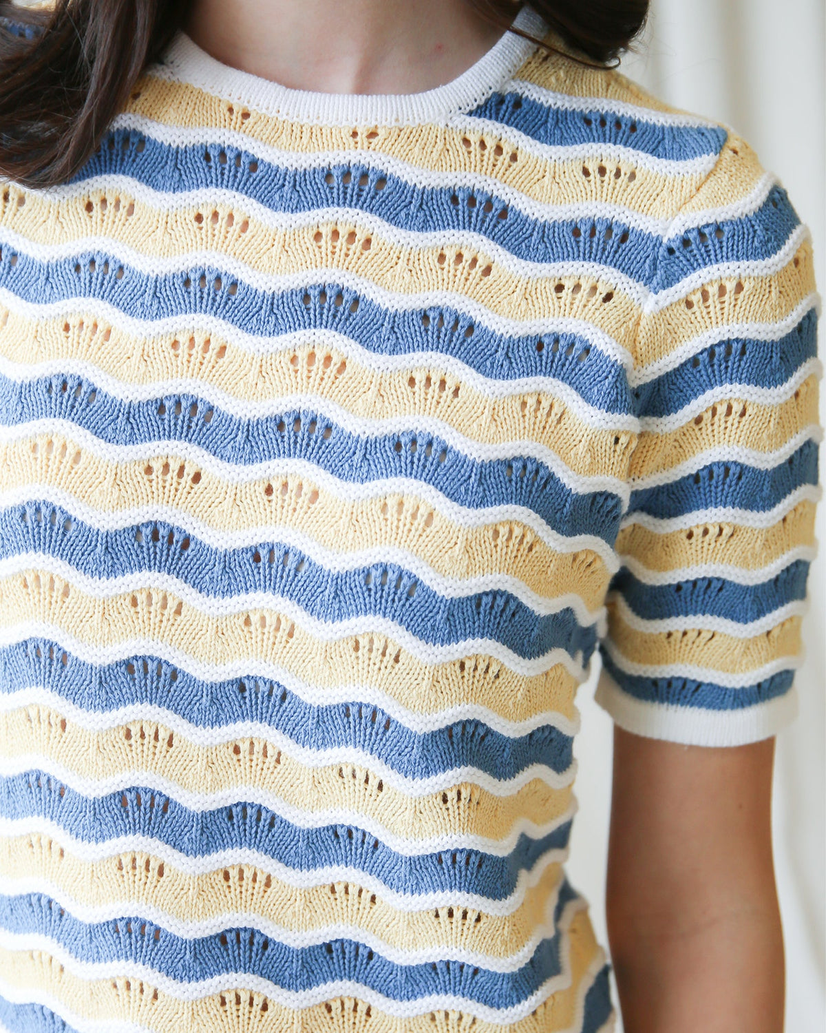 Downeast High Tides sweater in cozy knit, featuring a nautical-inspired design with ocean wave patterns and a comfortable fit.