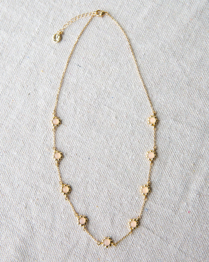 Mini flower necklace from Downeast featuring delicate floral pendant on a fine chain.