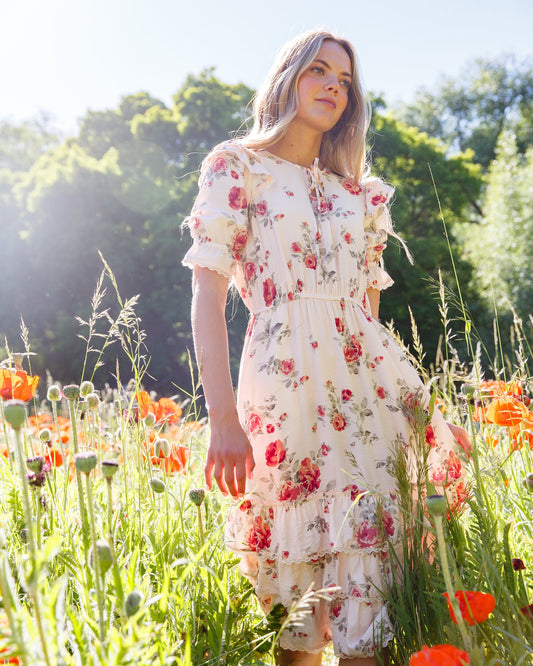 Vintage Romance Dress by Downeast, featuring a floral pattern, flowing fabric, and classic design perfect for romantic occasions.