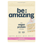 Be Amazing vegan protein powder in birthday cake flavor, showing the colorful tub with a scoop of protein powder.