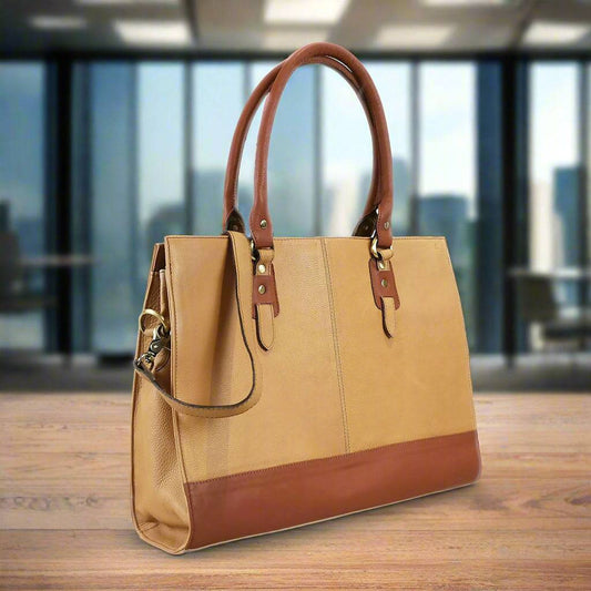 Beige leather women's laptop bag by GoodHides, 17-inch Signature style with sturdy handles and sleek design.