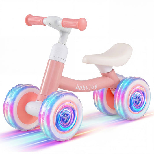 Baby balance bike by GBruno with adjustable handlebar and seat, featuring wheels with built-in lighting for safety and fun.