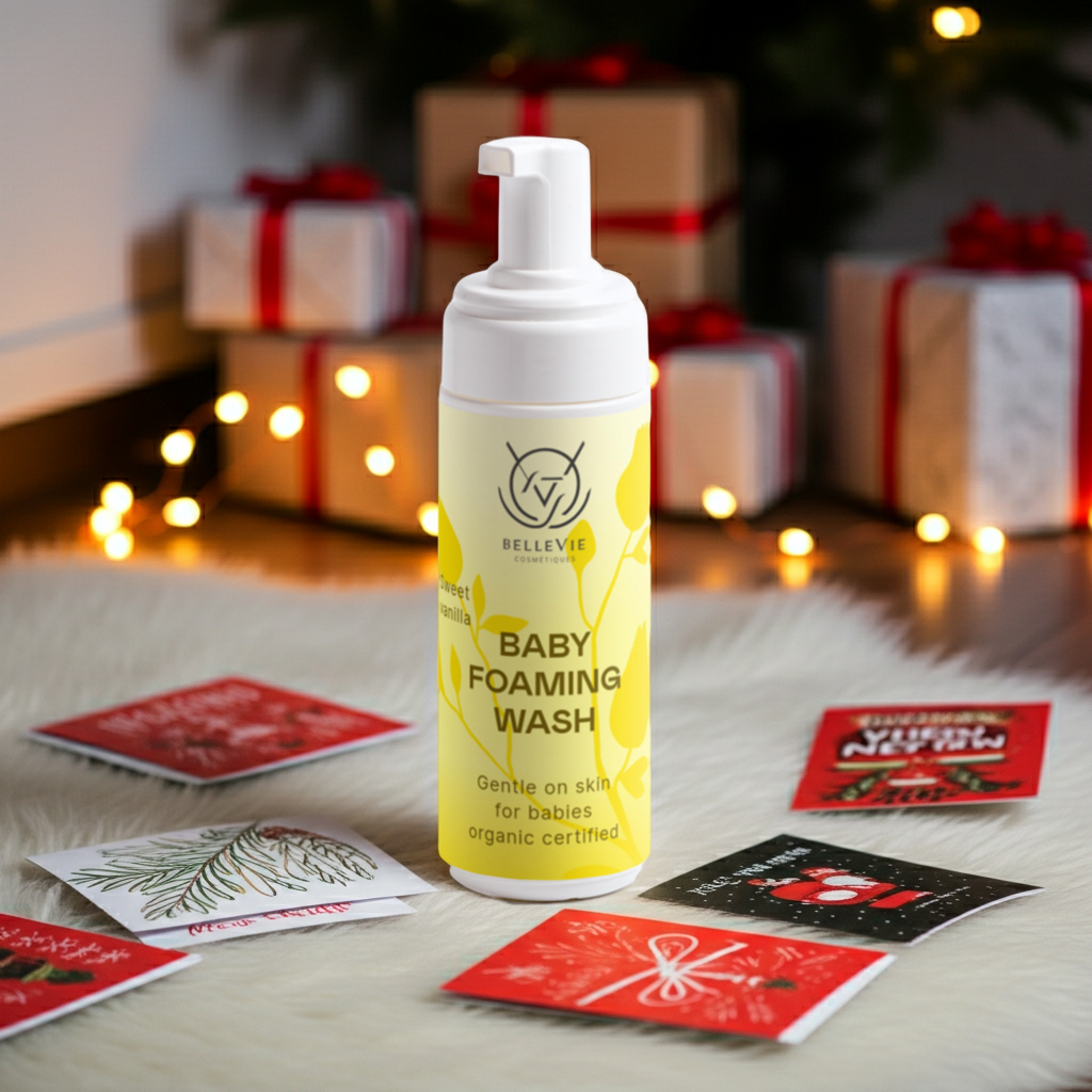 Belleviecosmetic baby foaming wash bottle with yellow label, gentle nut-free cleanser for newborns on festive background.