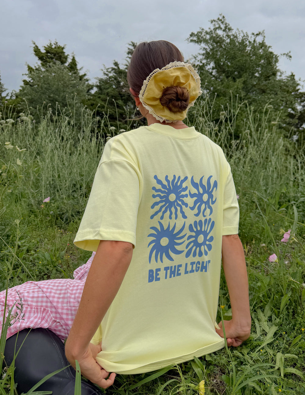 Unisex T-shirt from Elevated Faith with "Be the Light" printed design, casual fit, and comfortable fabric for everyday wear.