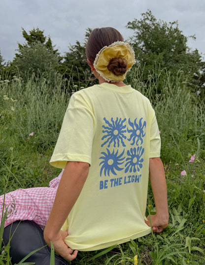 Unisex T-shirt from Elevated Faith with "Be the Light" printed design, casual fit, and comfortable fabric for everyday wear.