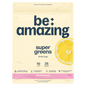 Pink lemonade flavored Be Amazing Super Greens powder in a canister, showcasing vibrant packaging and fresh green ingredients.