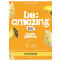 Be Amazing Super Greens powder in a jar with a Dole Whip Pineapple flavor label, showing vibrant green supplement contents.