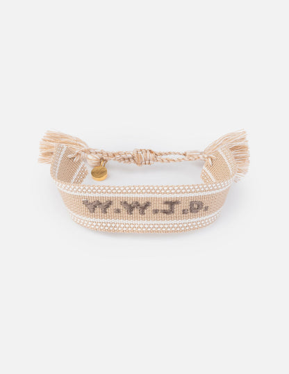 Beige WWJD embroidered wristband bracelet by Elevated Faith with stitched religious message on fabric band.