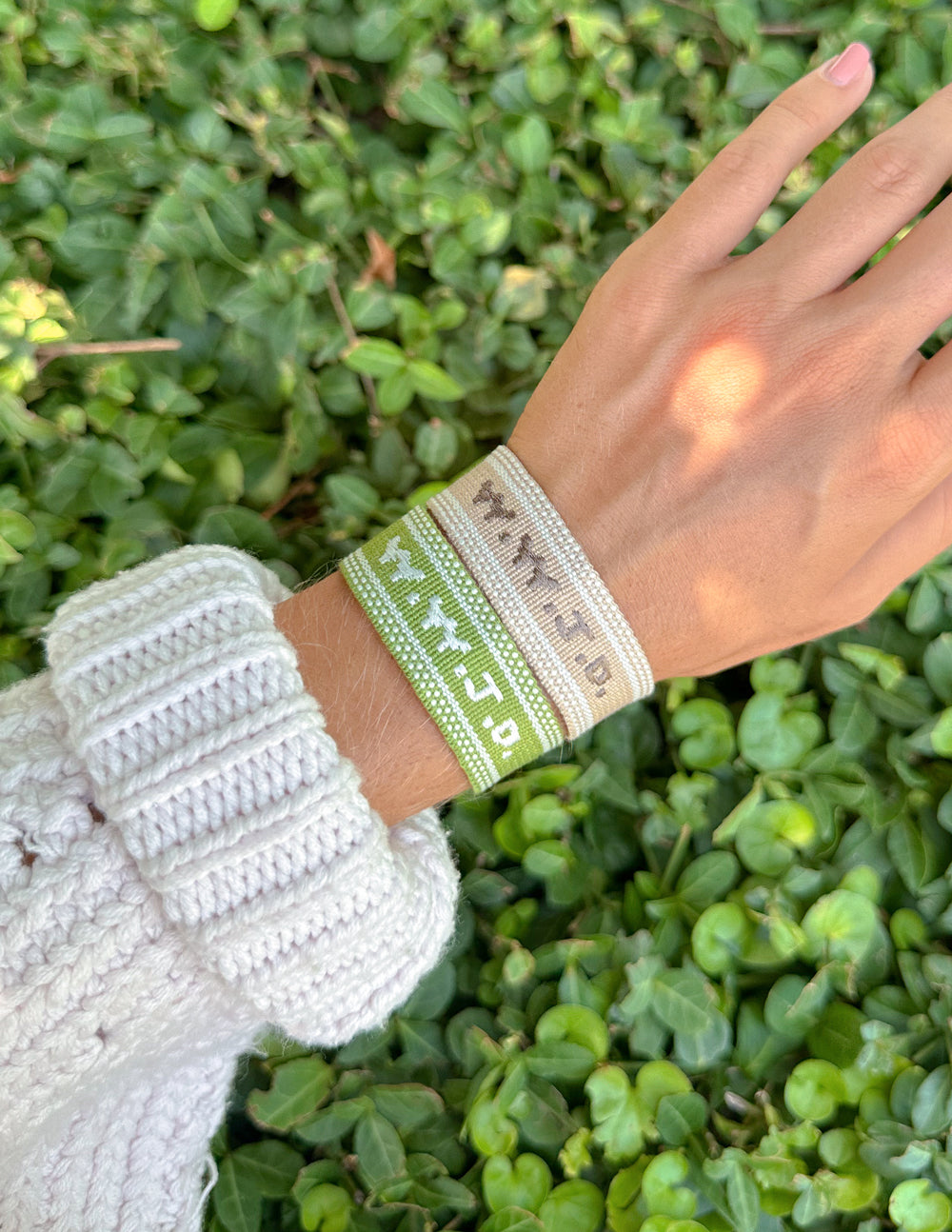 Beige embroidered WWJD wristband bracelet by Elevated Faith with stitched message and casual design.
