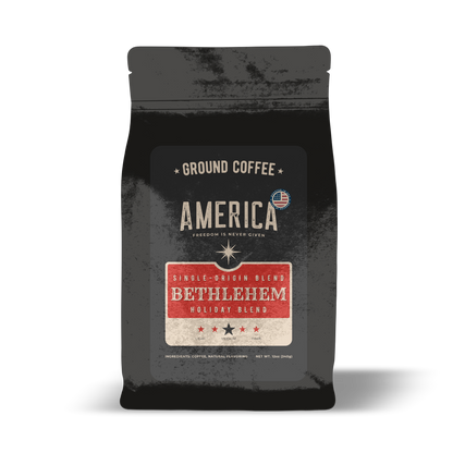 Ground Bethlehem Holiday Blend coffee by America Supply Company LLC in a clear bag with a dark roasted appearance.
