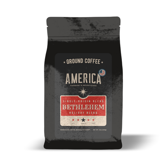 Ground Bethlehem Holiday Blend coffee by America Supply Company LLC in a clear bag with a dark roasted appearance.