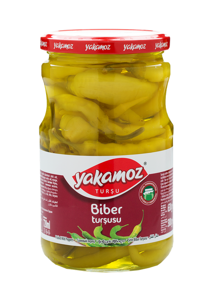 Glass jar of S101 Yakamoz Mild Pepper Pickle with whole peppers, showcasing the colorful, spicy peppers inside.