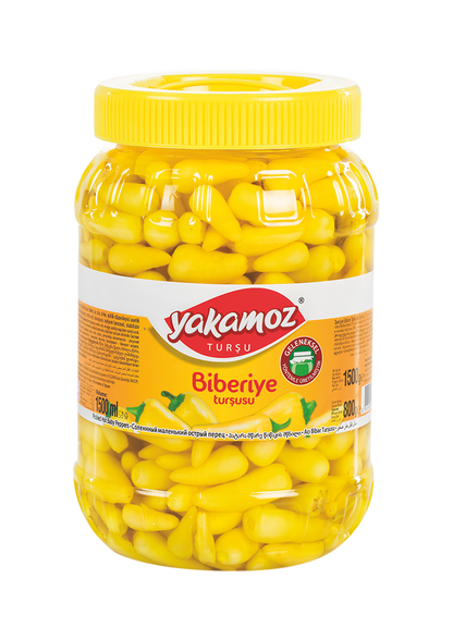 Glass jar of Yakamoz Hot Baby Pepper Pickles by S101, featuring vibrant, spicy baby peppers in a clear jar.