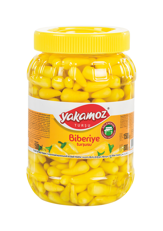 Glass jar of Yakamoz Hot Baby Pepper Pickles by S101, featuring vibrant, spicy baby peppers in a clear jar.