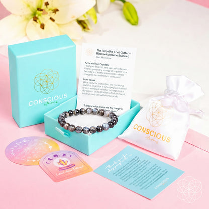 Black moonstone bracelet from Conscious Items, featuring a sleek design and packaging, called The Empath’s Cord Cutter bracelet.