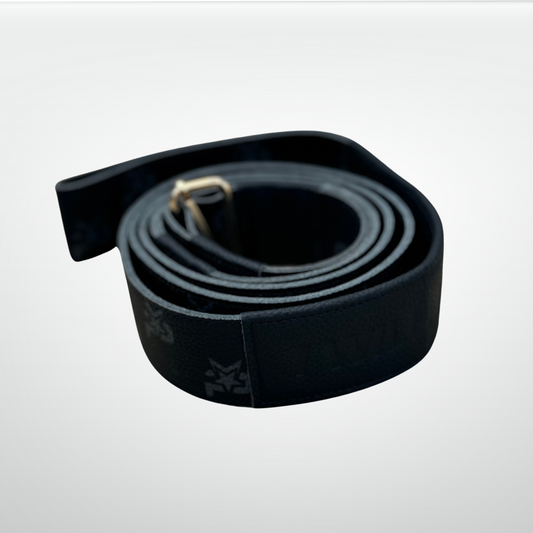 Black leather I AM Monogram Yoga Strap by iReliev, a luxury fitness accessory for stretching and flexibility exercises.
