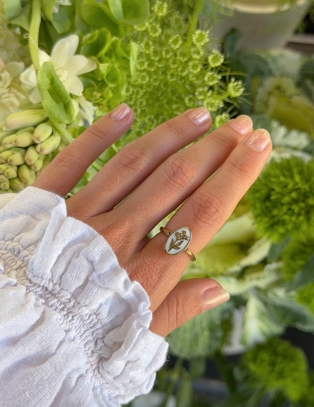 Elevated Faith Bloom Again enamel ring featuring colorful floral design on a silver band, showcasing detailed craftsmanship.