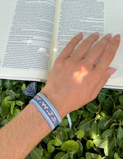 Blue WWJD embroidered bracelet wristband from Elevated Faith, featuring Christian message and blue fabric band.