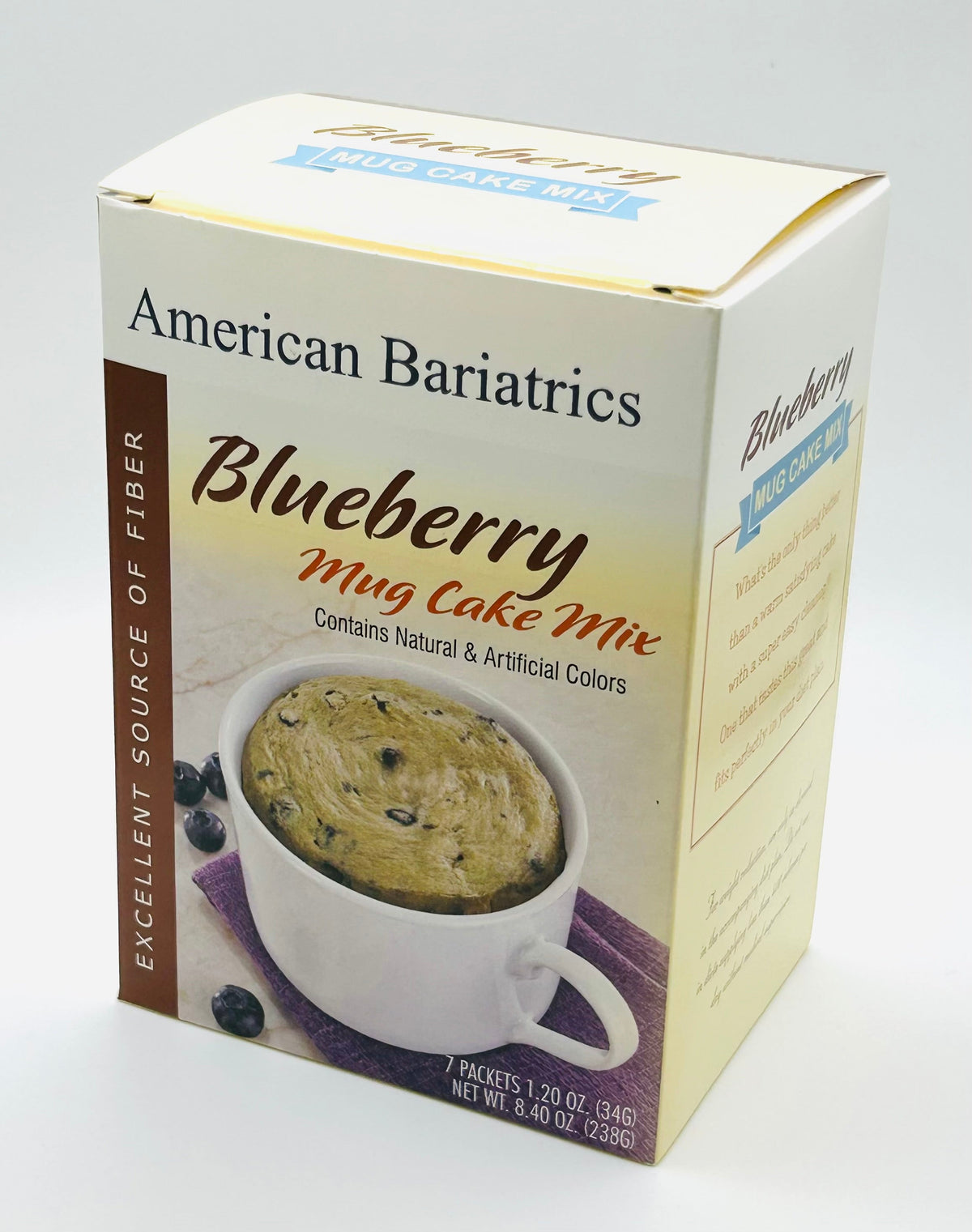 AmBari Nutrition blueberry mug cake in a bowl, showing a moist blueberry-flavored food treat with fresh blueberries on top.