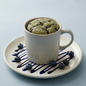 AmBari Nutrition blueberry mug cake in a bowl, showcasing a moist, blueberry-filled foods dessert with fresh blueberries on top.
