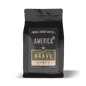 Whole Brave Breakfast Blend coffee beans from America Supply Company LLC, showcasing fresh, roasted coffee beans in a natural setting.
