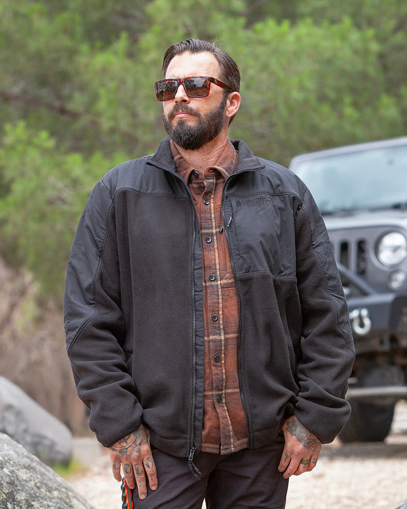 Black Bruin fleece zip-up jacket from Off The Grid Surplus, featuring a cozy fleece fabric and front zipper closure.