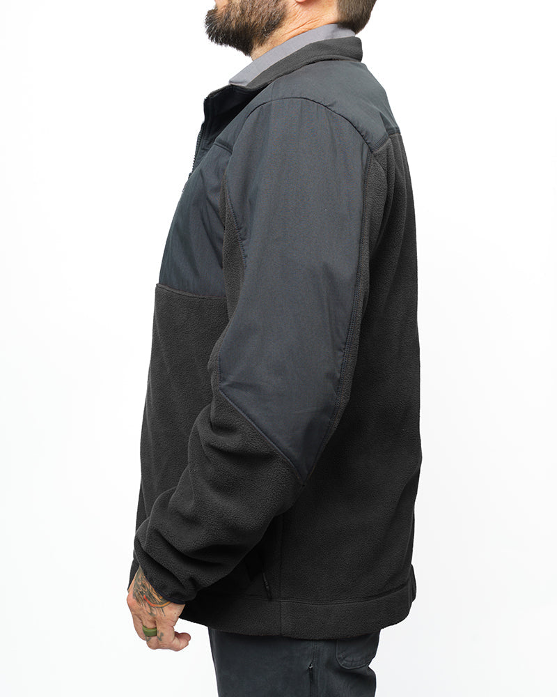 Black Bruin fleece zip-up jacket by Off The Grid Surplus, shown with front zipper and soft fleece fabric.