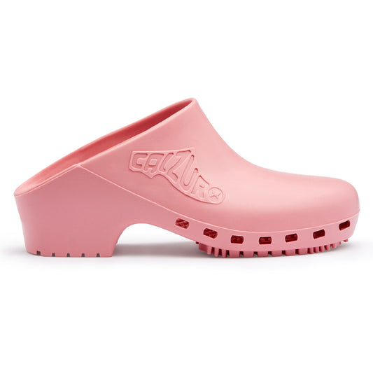 Pink Calzuro Classic clogs without holes, featuring a smooth bubblegum-colored design and slip-resistant sole for healthcare use.