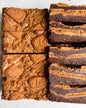 Let's Get Baked artisan Biscoff brownie cake with a rich, fudgy texture and swirls of Biscoff spread on top.