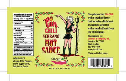 Cinderosa Ranch Cin Chili Serrano hot sauce bottle with bright label, showcasing vibrant orange and green chili peppers on the label.