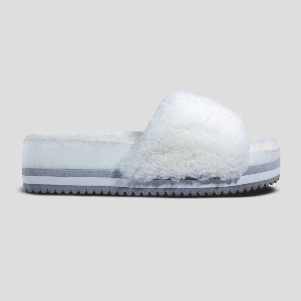 Fleks San Ysidro Cito Slide Iceberg sandal with single strap and profile view, showcasing its minimalist design and neutral color.