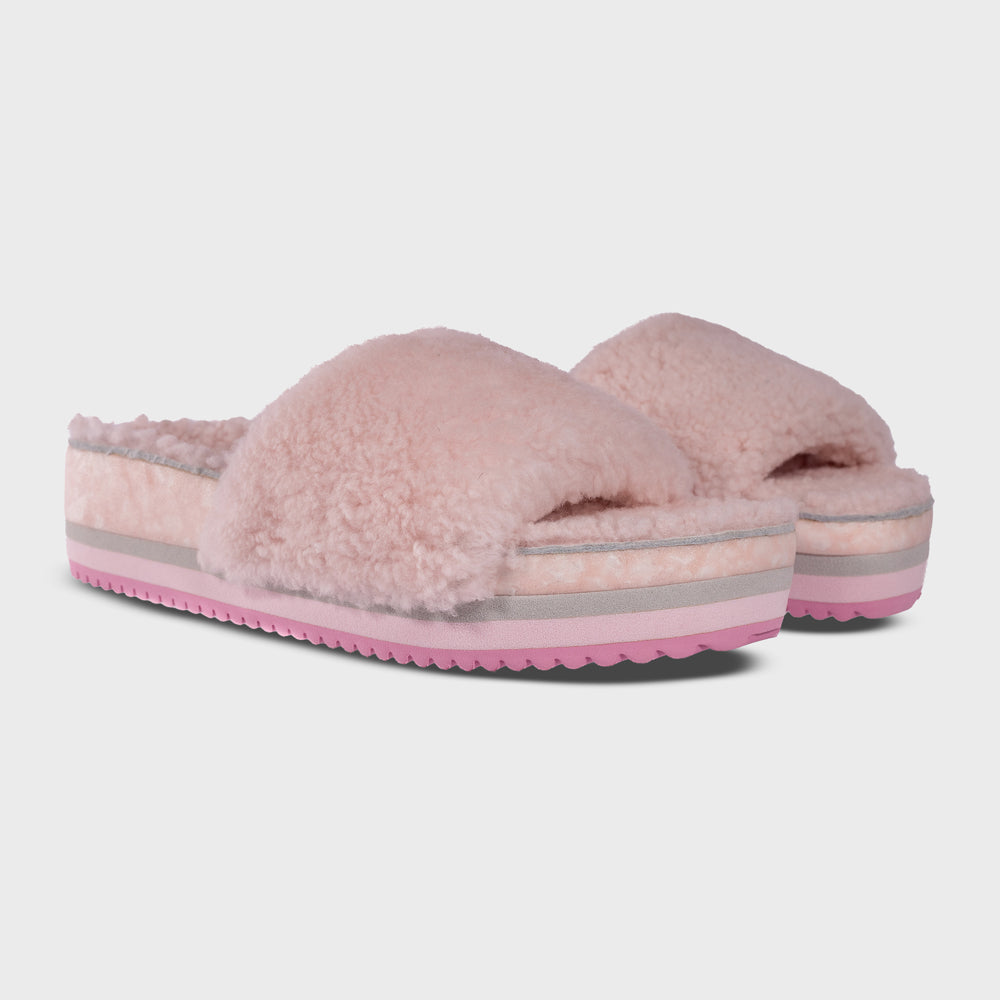 Pair of Fleks San Ysidro Slides in Peony color, showing the comfortable slip-on design and textured straps from an angled view.