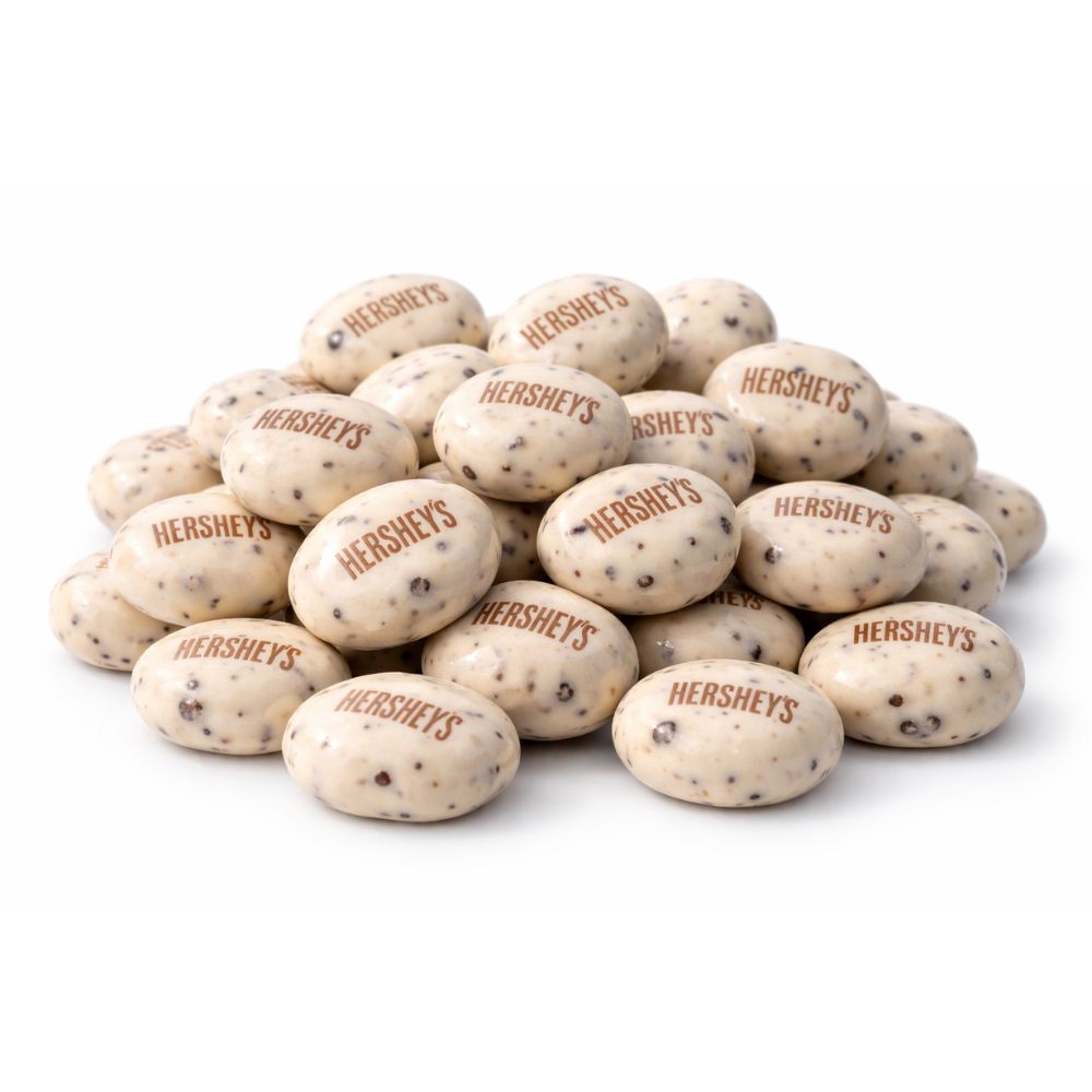 Hershey's Cookies 'N' Creme Drops Candy in a bulk value bag, showing small creamy white and cookie-filled chocolate drops.