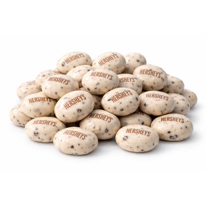 Hershey's Cookies 'N' Creme Drops Candy in a bulk value bag, showing small creamy white and cookie-filled chocolate drops.