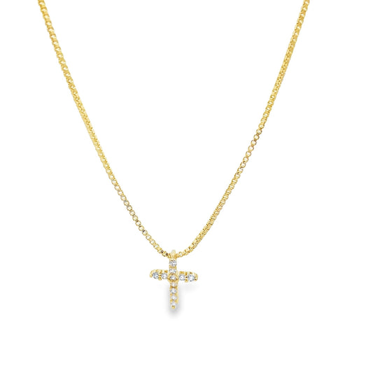 Dainty gold CZ pave cross pendant on a box chain necklace by Mia Jewelry, showcasing a sparkling religious jewelry piece.