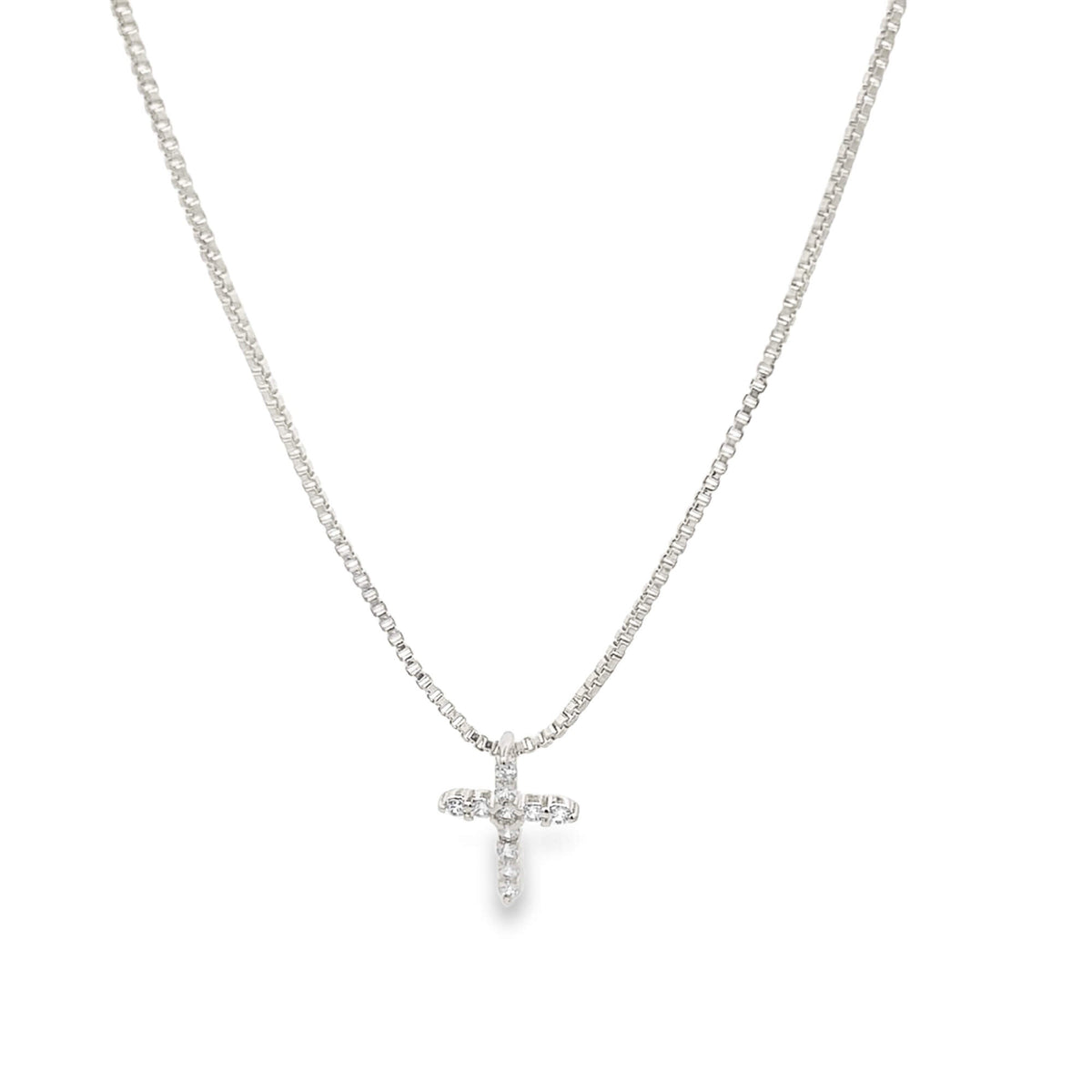 Dainty CZ pave cross pendant necklace on box chain by Mia Jewelry, showcasing a sparkling cross charm on a sleek silver chain.