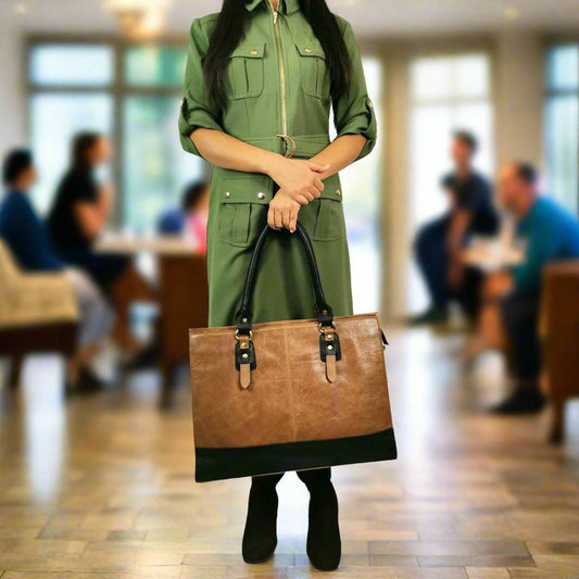 GoodHides Signature 17-inch leather laptop bag in copper with sturdy handles and sleek design, perfect for professional use.