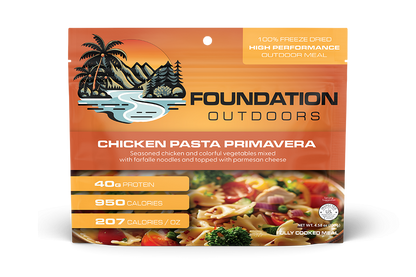 Foundation Outdoors Chicken Pasta Primavera meal pouch showing cooked chicken, pasta, and colorful vegetables in a ready-to-eat meal.