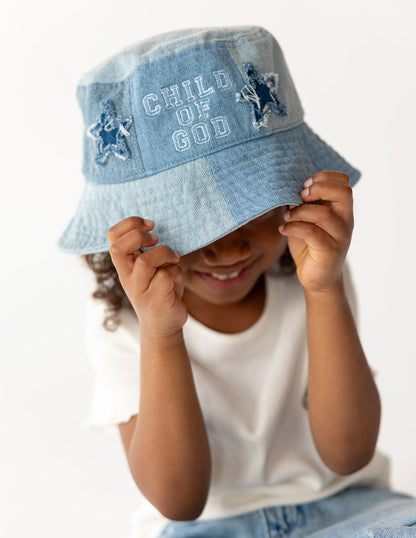 Child of God denim kids bucket hat by Elevated Faith, featuring a stylish and durable design for young children.