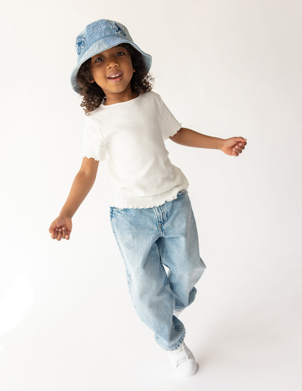 Kids denim bucket hat by Elevated Faith featuring "Child of God" embroidery, perfect for children’s casual outdoor wear.