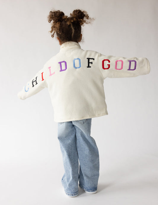 Kids fleece pullover by Elevated Faith featuring "Child of God" design, soft and cozy for children.