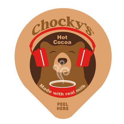 A steaming cup of Chocky's Hot Cocoa by Java House with whipped cream and chocolate drizzle on top.