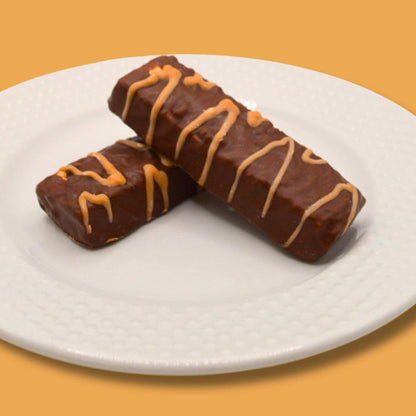 AmBari Nutrition Chocolate Caramel Wafer Bars showing layered chocolate and caramel filling with a crispy wafer exterior.