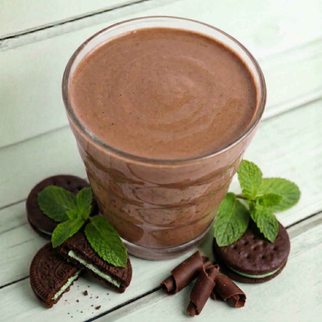 AmBari Nutrition Chocolate Chill Mint Shake in a glass with a straw, showcasing the mint and chocolate flavor.