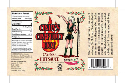 Cindy's Cin-fully Hot Cayenne Hot Sauce bottle from Cinderosa Ranch with bright label and fiery red hot sauce inside.