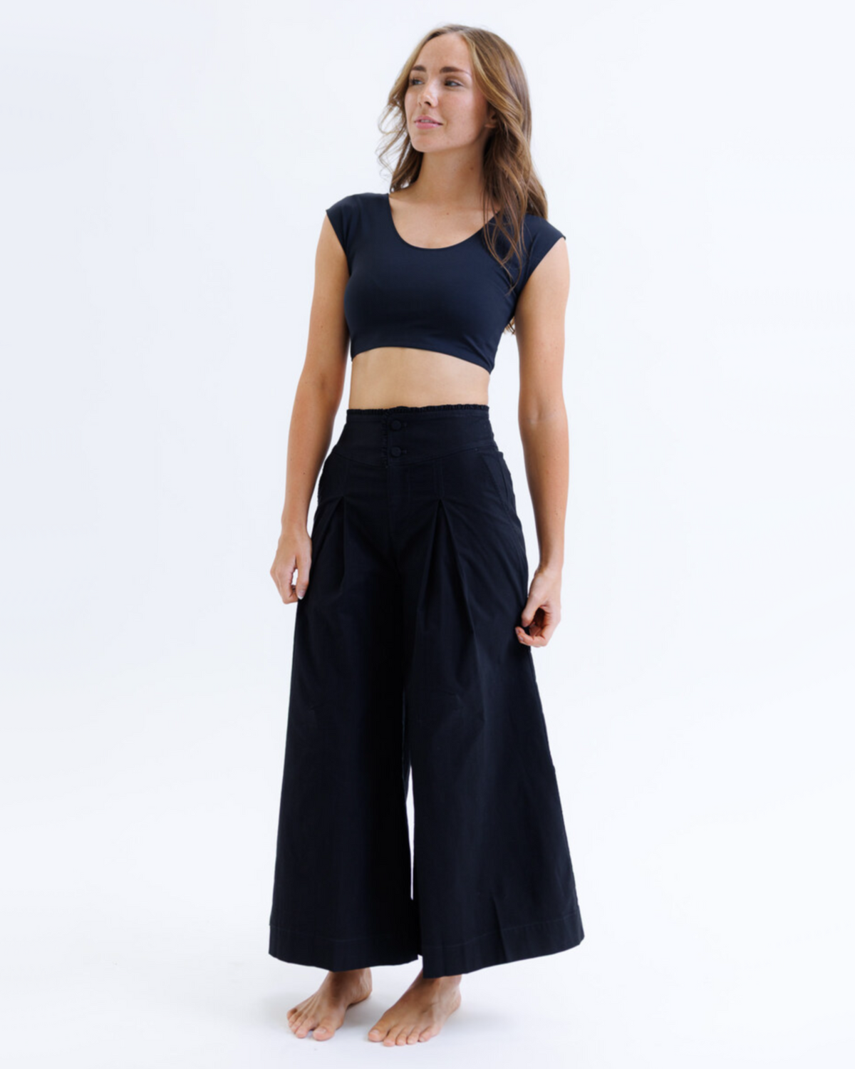 Black Downeast Contour Demi Tee displayed on a model, showcasing its fitted silhouette and casual style.