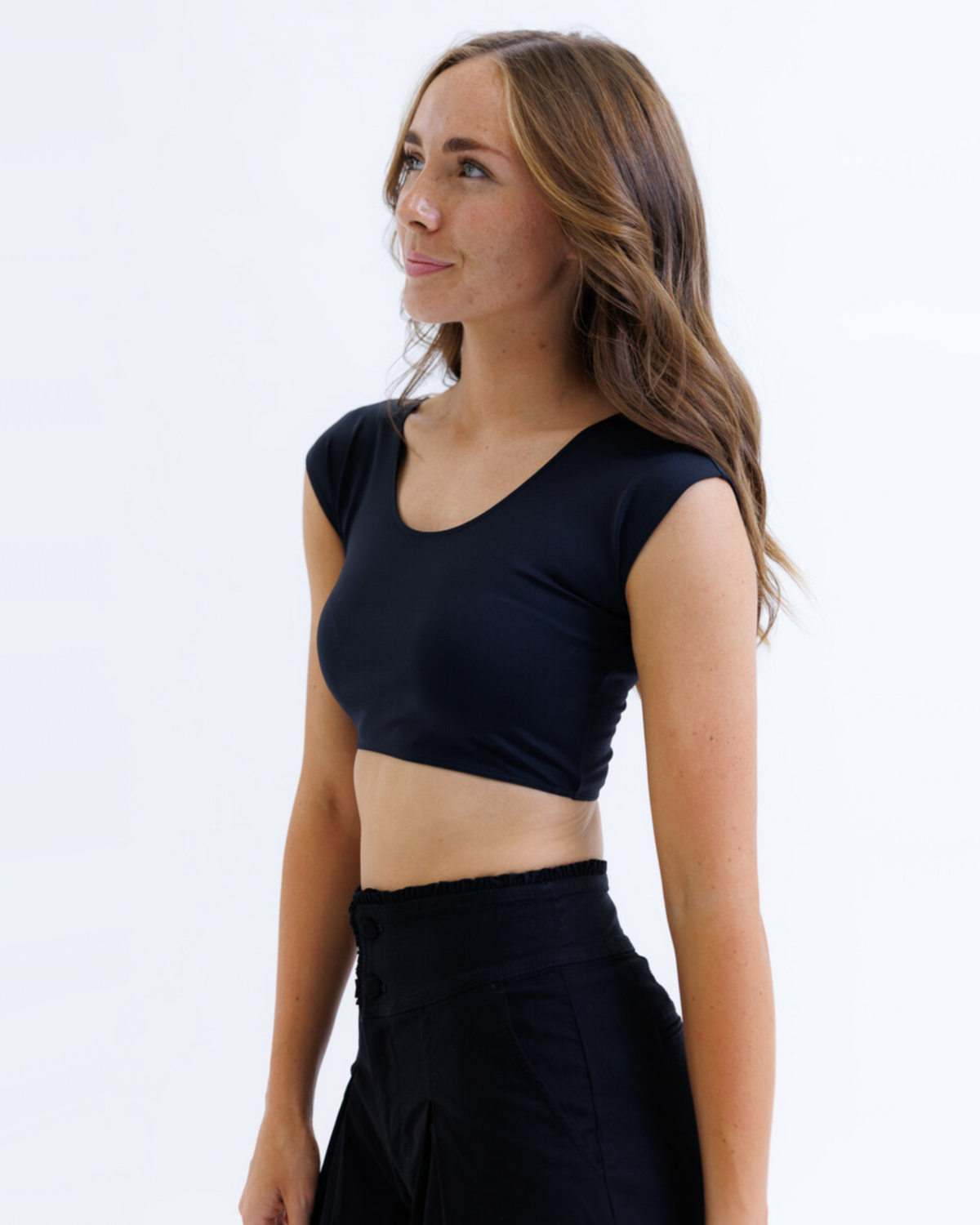 Black Downeast Contour Demi Tee displayed on a hanger, showcasing its fitted style and soft fabric.